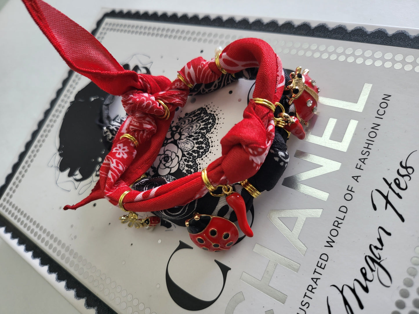 Golden Rebel – Light Red Bandana Bracelet with Ladybug Charms